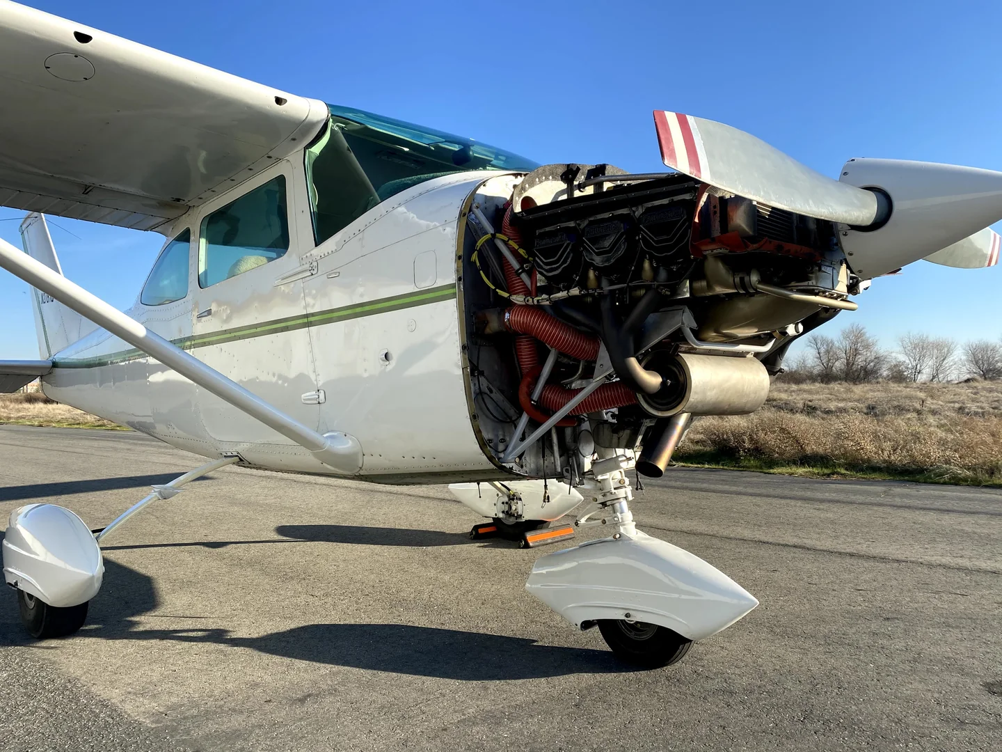 Airframe Envy working on a Cessna with the engine cowling removed